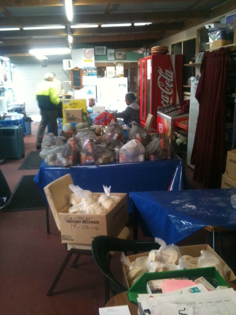 Packing up food to hand out a weekly Christ Mission Possible dinner in St Mary's. 