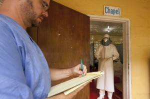 Dr Brantly (in white) giving medical orders