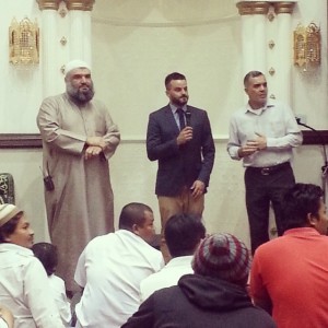 Brad Chilcott (middle) at a recent multi-faith service. 