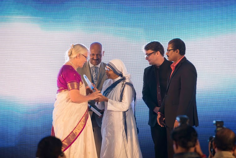 Gladys Staines receives her award. Credit: The Harmony Foundation