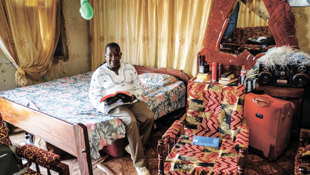 Edward Kajivora from Bible Society South Sudan in his home in Juba, with his Bible