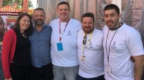 John Delezio, second from right, with MTS colleagues Emma and Ben Pfahlert, Adam McCormick and Samuel Thorn after an Easter service at the Royal Easter Show in Sydney.