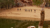 Trekkers walk the Larapinta Trail in NT